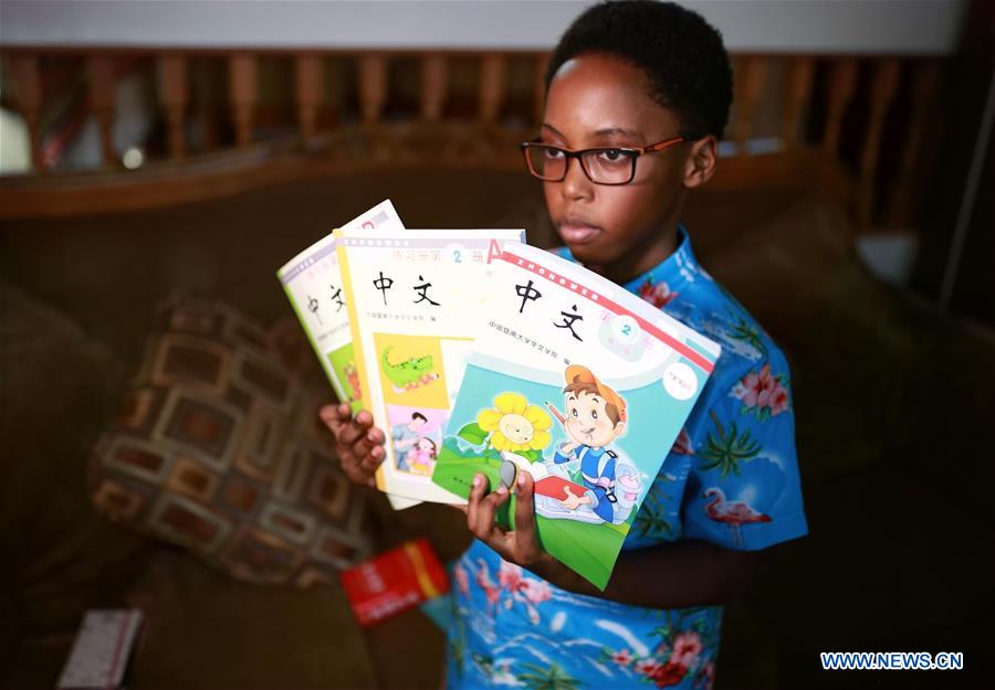 U.S.-CHICAGO-AFRICAN AMERICAN BOY-CHINESE CULTURE-LEARNING