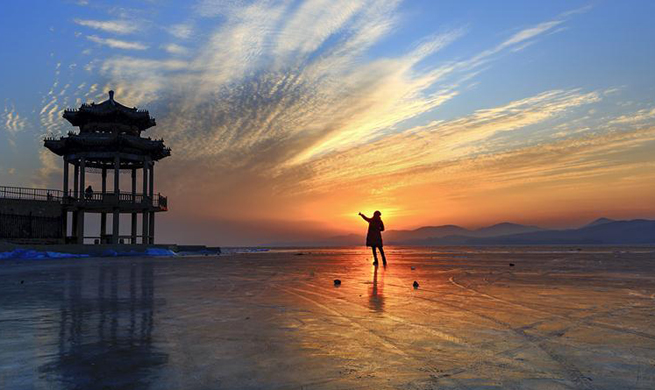 People view sunrise on New Year's Day